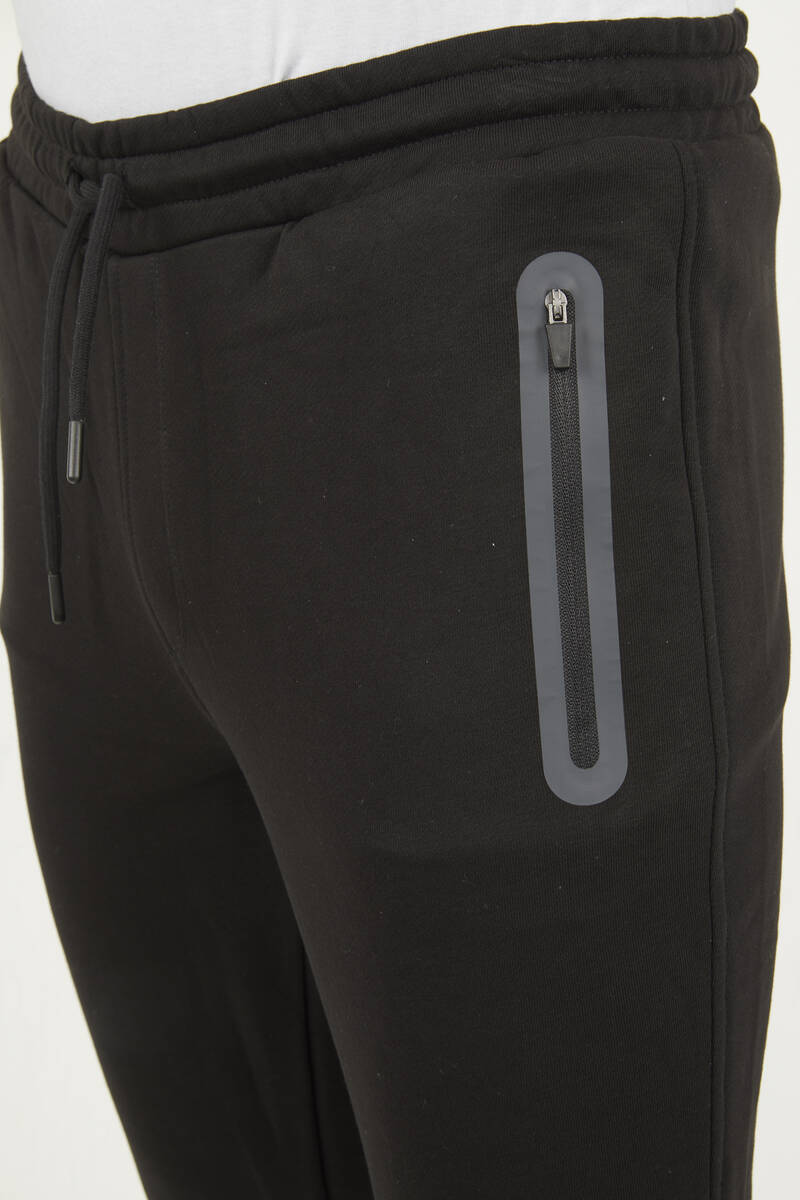 Спортивные брюки приталенного кроя с карманом на молнии